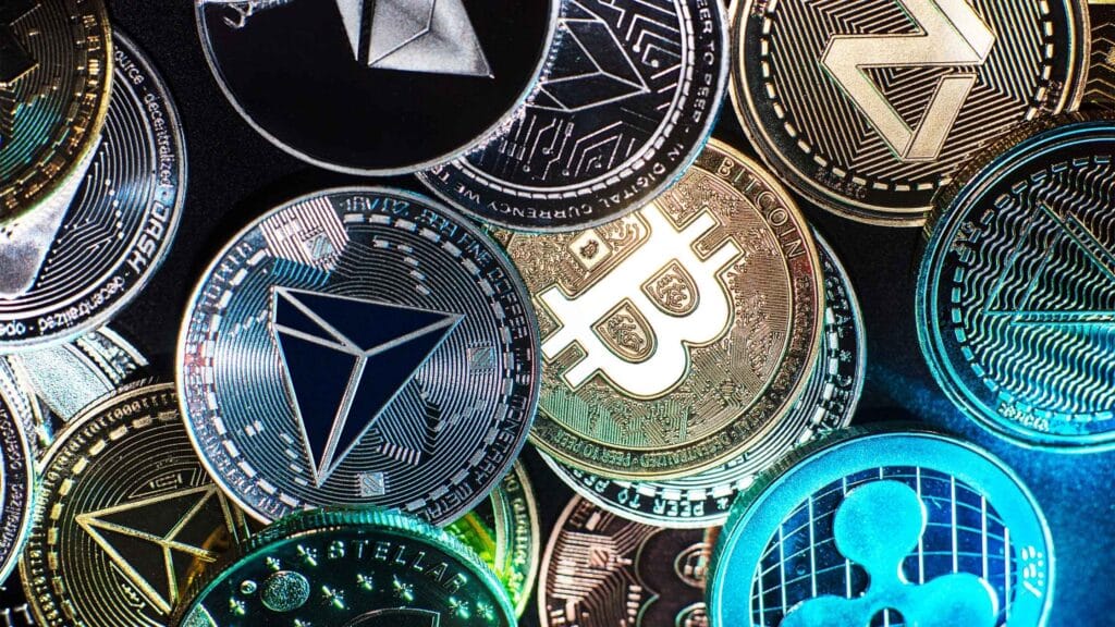 A bunch of cyrpto coins representing investing with coinbase