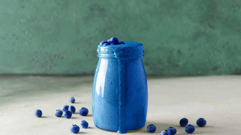 A handmade recipe jar used to create a blueberry drink that will be given to someone as a gift.